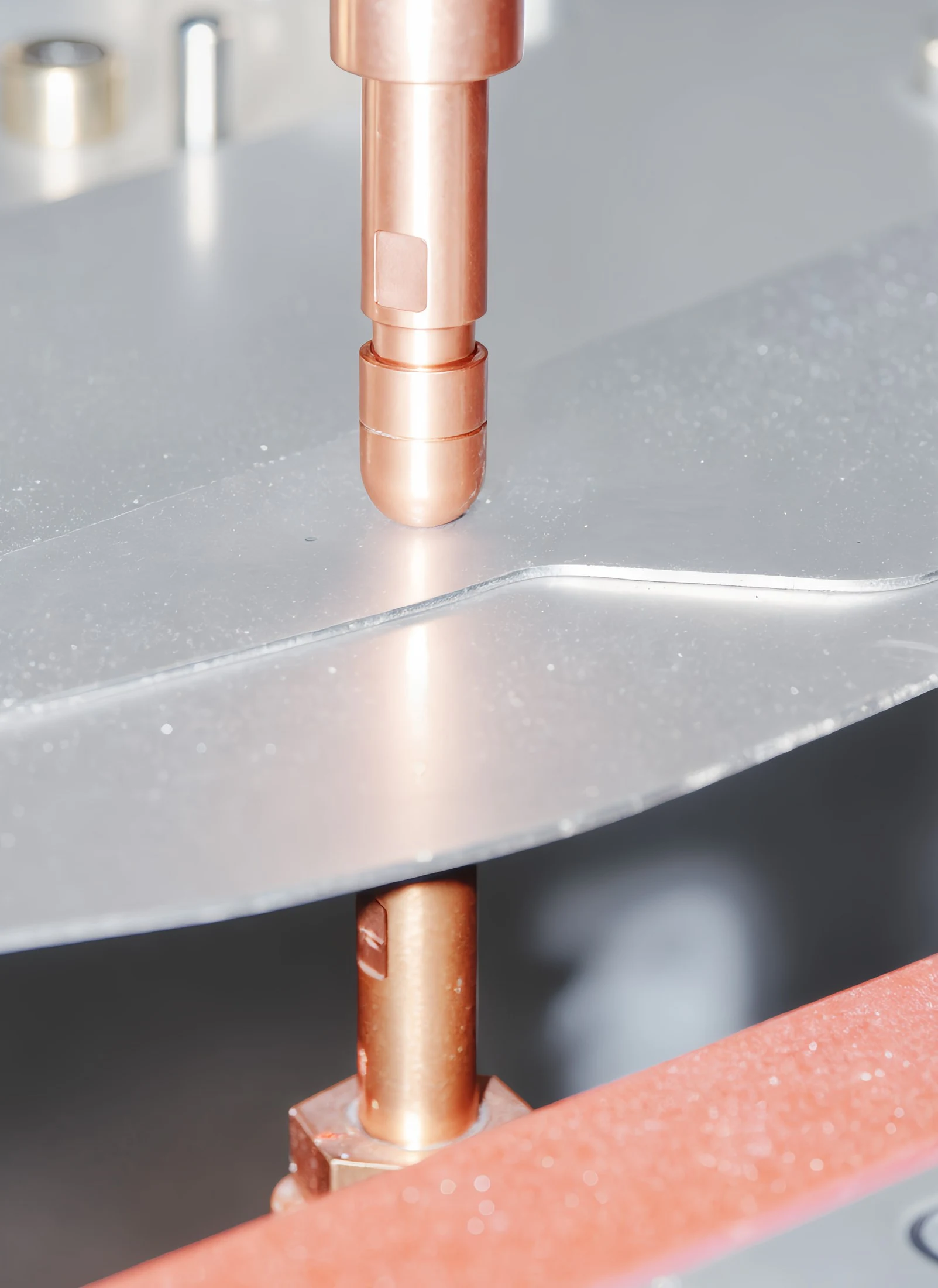 Copper electrodes closing on a sheet metal panel