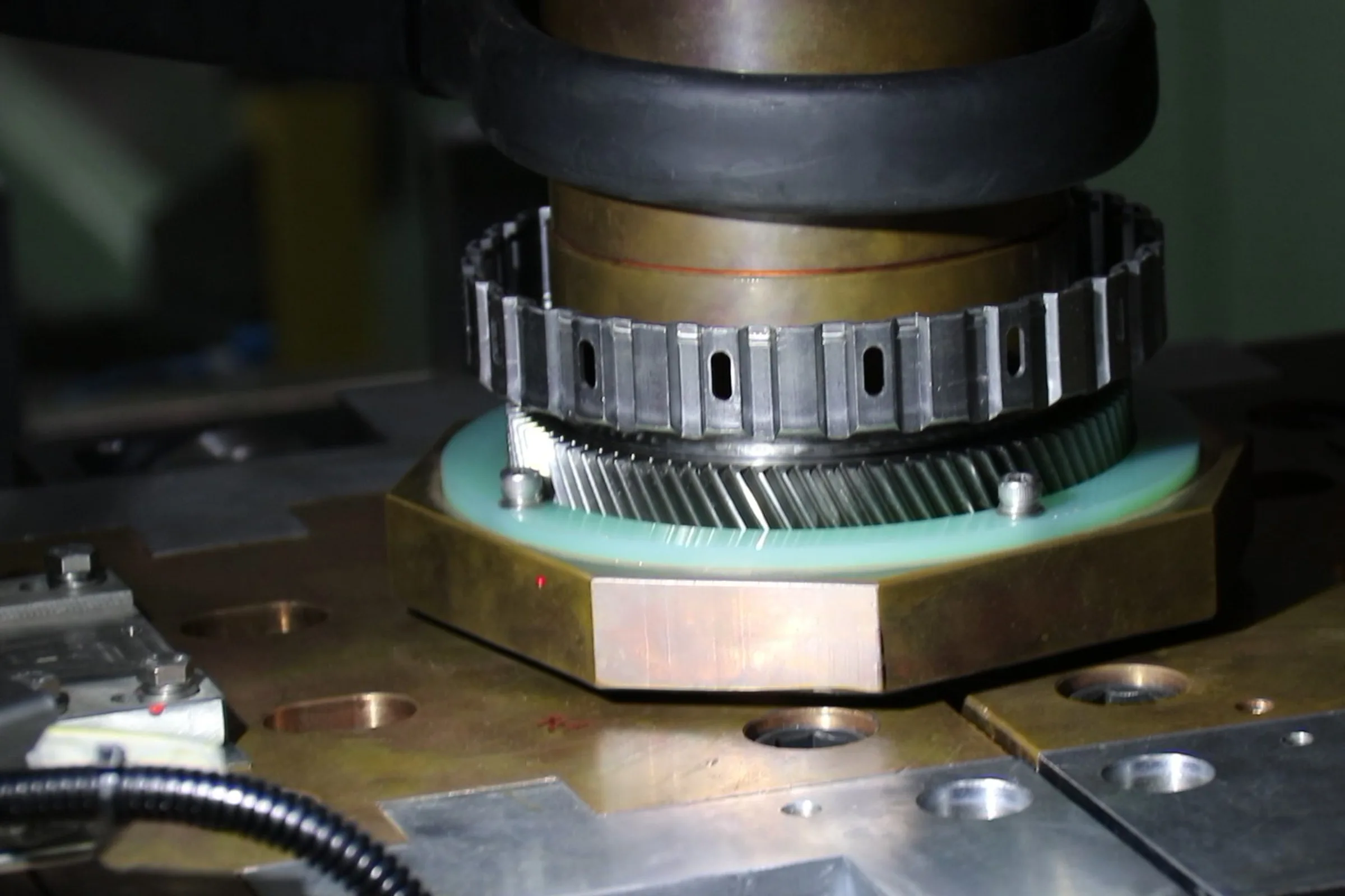 Projection welding a stamped cage onto a helical gear
